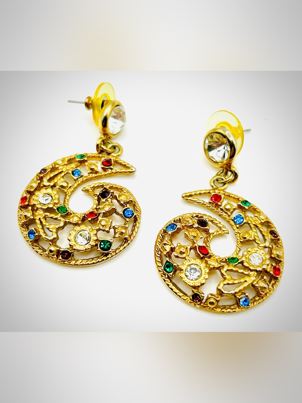 Jeweled crystal rhinestone swirl gold tone statement dangle pierced earrings